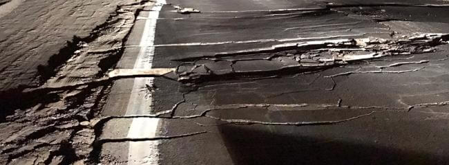 photo of road damage caused by an earthquake